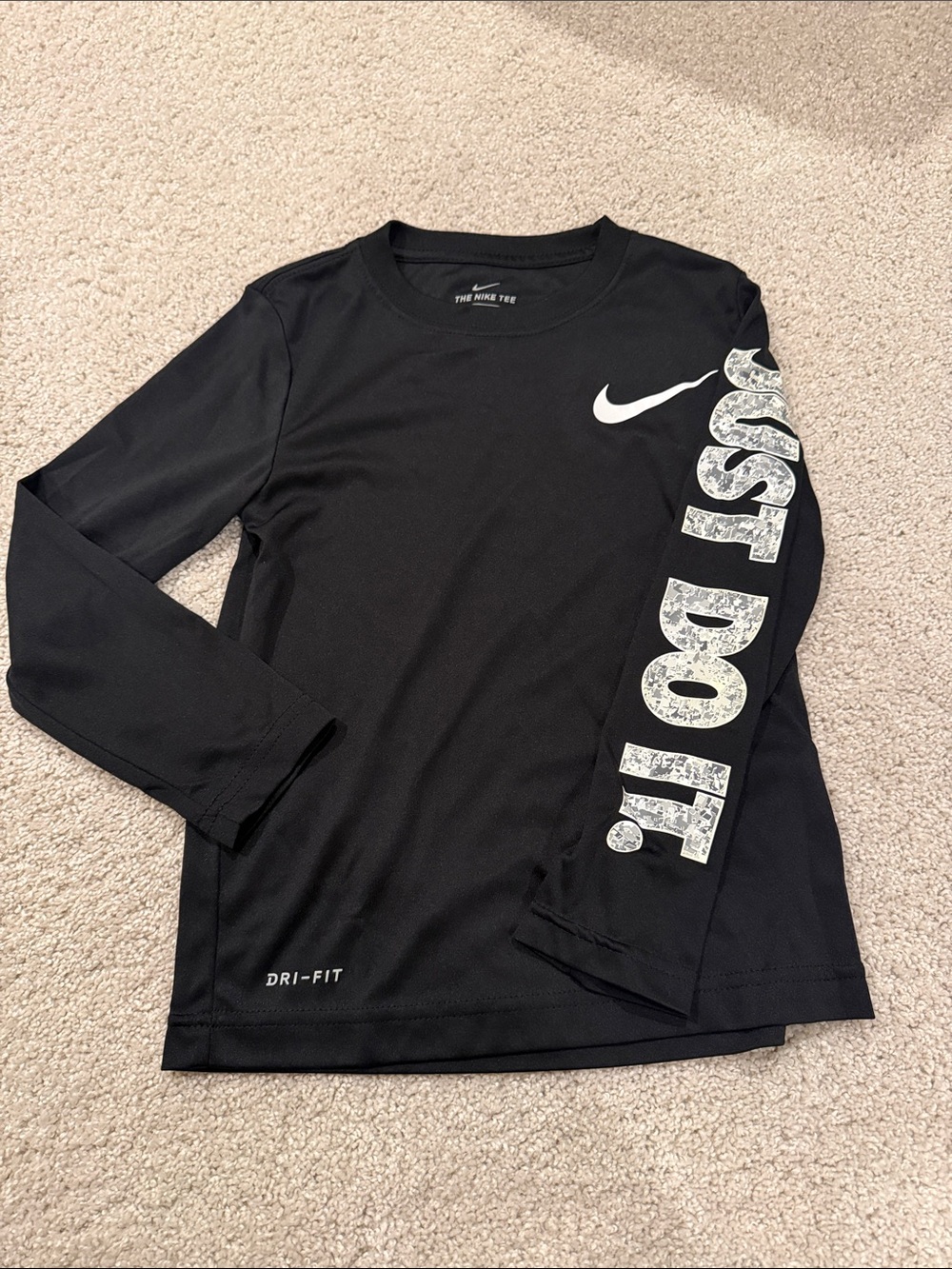 Nike Dri Fit Kids Black Long Sleeve Tee with White 'Just Do It' Sleeve. Size 5